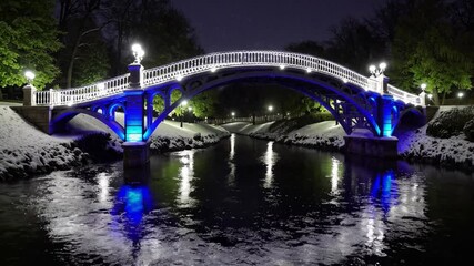Poster - Enchanted winter bridge illuminated night with snow, glowing lights, river reflection, peaceful serene scene, beautiful