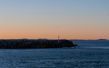 Wall Mural - Sunset view at Port Macquarie breakwall, Australia.