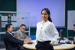© NVB Stocker - Portrait Asian business woman : Young confident smiling Asian business woman leader, professional entrepreneur company executive ceo manager. Team meeting