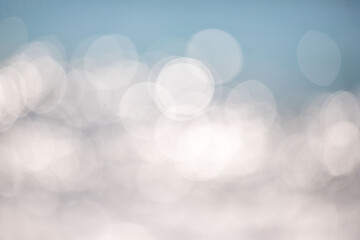 Wall Mural - the image is a blurry background of a blue sky with white clouds