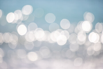 Wall Mural - the image is a blurry background of water with white circles