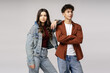 © Maria Vitkovska - Young stylish models posing with crossed arms and denim jacket