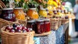 © JorgeL - Jams and preserves at farmers market homemade fruit spreads in glass jars gourmet food product display table