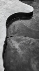 Poster - Fluid metallic form juxtaposed against structured tiled surface in monochrome