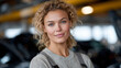 © Denis Yevtekhov - Empowered Woman Repairing an African Woman's Vehicle in a Garage