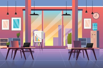 Poster - A modern office space featuring desks, laptops, and large windows displaying a sunset view. Plants and decor enhance the vibrant workspace atmosphere.