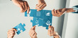 © InfiniteFlow - A dynamic scene of diverse hands working together to assemble blue puzzle pieces, symbolizing collaboration, growth, and successful teamwork in a modern office environment. Amity