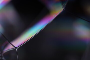 Fototapete - Bright rainbow reflection of liquid in macro, silver colors, surrealistic background, fantastic smooth movement, silver concept, silver ink