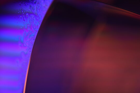 	
Purple and orange liquid abstraction, phenomenal water forms, glossy glass background 
