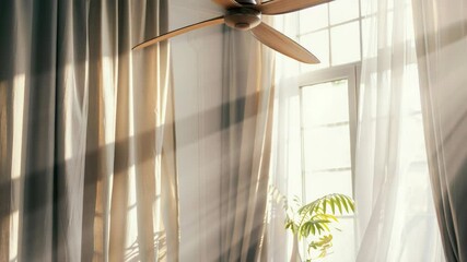 Aufkleber - A ceiling fan sitting in front of an open window, with natural light streaming in