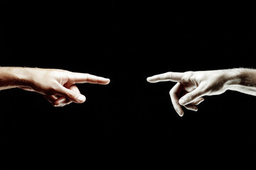 Poster - Two hands reaching towards each other in contrast with a dark background