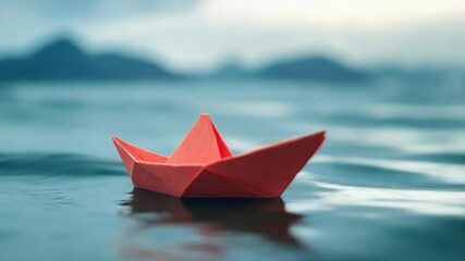 Poster - A small paper boat floats peacefully on the surface of a quiet body of water