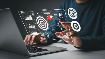 Poster - Man using laptop with digital overlay of target, graphs, and data visualizations displayed