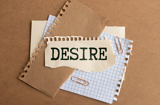 Desire text concept. DESIRE word, text written on a white business card