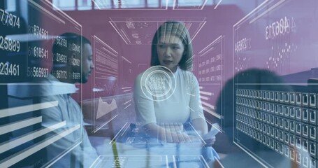 Poster - woman reading document activating data panels while peer observing updating business charts