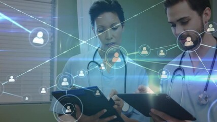 Poster - Doctors reviewing patient data sparking user icons linking to network for health connectivity