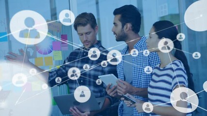 Poster - Business team pointing at notes and tapping devices, revealing network overlay for collaboration