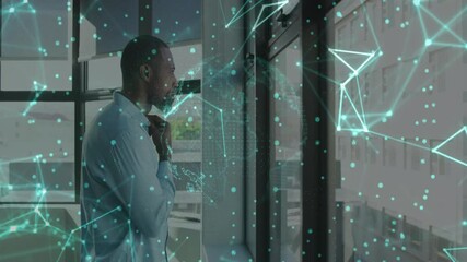 Poster - Businessman standing in office holding chin initiating data overlay rotating map analyzing network