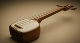 Close up view of a stringed musical instrument with a brown neck and a white body on a beige surface
