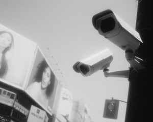 Poster - Urban Security Camera Surveillance System on Street Pole with Reflective Lenses Monitoring City Intersection in Contemporary Metropolitan Environment