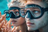 Underwater couple admiring coral