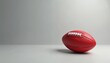 © Vadym - Red Australian Rules Football isolated on gray background. Digital artwork of the Aussie Rules football ball. Game sport equipment for competition. Illustration for Aussie rules game events.