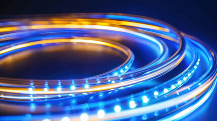 Poster - Curved ribbons of light create mesmerizing composition, blending smooth blue and orange hues in dynamic display. vibrant colors evoke sense of energy and movement