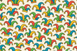 © NanieStudio - Seamless pattern with colorful jester hats. Funky carnival background design. Vector graphic of fool caps for festival, Mardi Gras, or April Fools' Day celebration party texture.