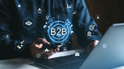 Poster - B2B technology and digital partnership concept with businessperson using smartphone and laptop surrounded by business icons on dark background.