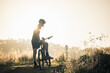 © Austockphoto - Silhouette of teenage boy on rural dirt road bathed in vibrant afternoon light