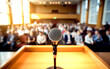 © MUZIHID CREATION - Microphone on podium in front of large audience