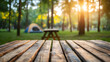 © Daniel - A High Resolution image of relaxing holiday. Travel and camping adventure lifestyle in park with outdoor tent and wooden table on blur background.