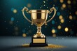 © graphicview35 - Gold trophy award with glitter on dark background