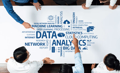 Aufkleber - A team of professionals collaborates around a table, analyzing various data and analytics concepts depicted on a whiteboard in a modern workspace environment. Amity