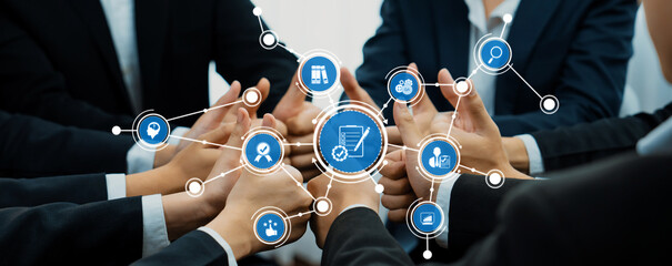 Poster - A group of professionals unites their hands in a gesture of teamwork, surrounded by digital icons representing collaboration, strategy, and innovation in a modern business setting. Amity