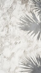 Poster - Shadows of Tropical Leaves Casting Patterns on a Textured White Wall During Bright Daylight Hours