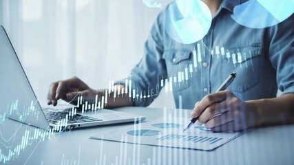 Poster - Person analyzing stock market data on laptop and paper with pen in a bright office setting