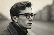 © Viktor - Vintage black and white portrait of young man with glasses. Retro style paper photo from 1970s. Caucasian face, looking into distance. Handsome man with classic hairstyle, serious, old memories.