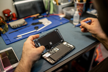 Poster - Technician Repairing Smartphone Screen in Workshop While Using Tools and Components to Ensure Device Functionality