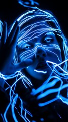 Leinwandbilder - A portrait of a woman with blue glowing lines across her face and hand in a dark background scene
