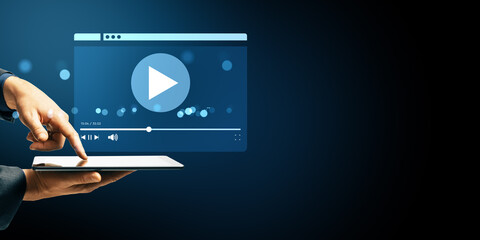 Poster - Person pressing tablet screen to play video with digital streaming interface on abstract dark background, representing modern mobile technology use.