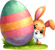 © Totimoa - Cute Easter Bunny Hiding in Grass with a Big Easter Egg