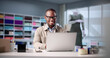 © Andrey Popov - Young African-American Man Using Laptop To Design Fashion