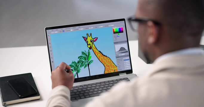 Young African American Man Edits Colorful Graphic Designs