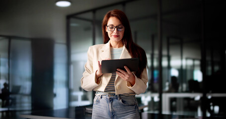 Poster - Busy Businesswoman Conducting Financial Analysis On Tablet
