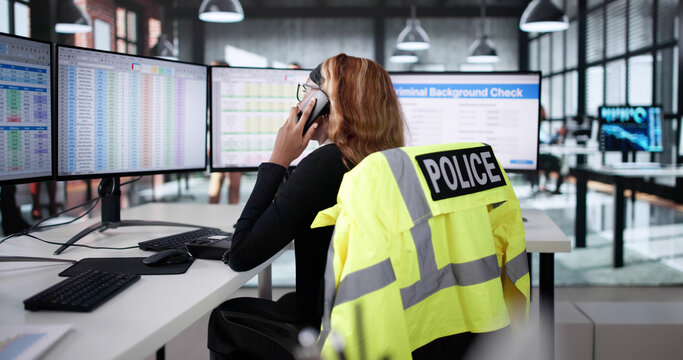 Female African American Police Officer Using Computer