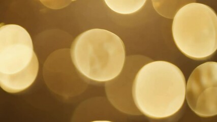 Poster - soft and warm abstract gold and yellow bokeh background with blurred circles of light for texture an