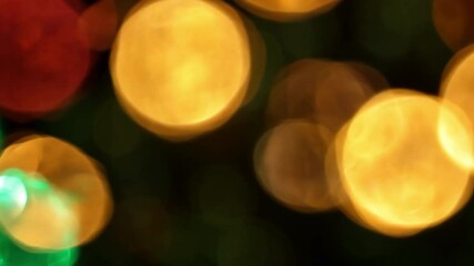 Poster - Vibrant Bokeh Lights Creating a Dreamy Atmosphere in Colorful Shades of Green, Red, Yellow, and Orange for Festive Events 4k video footage