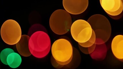 Poster - Vibrant Abstract Holiday Lights on a Christmas Tree Creating a Festive Atmosphere in a Dark Background 4k video footage