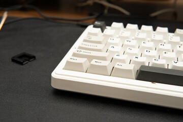 Poster - Close-up photograph of white mechanical keyboard on black desk mat for tech blogs product reviews office and gaming setup modern style